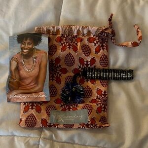 Noonday Collection bracelet and Floral Cosmetic Bag - Red and Orange